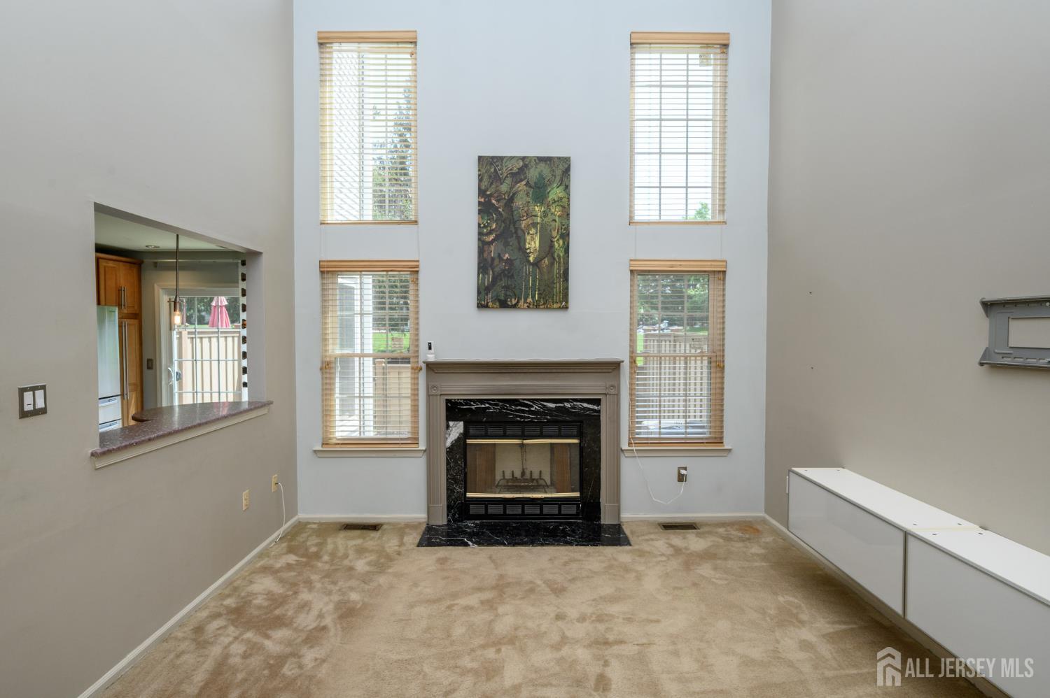 1907 Stech Drive Bridgewater, NJ 08807 - Photo 15 of 55 an empty room with windows and fireplace