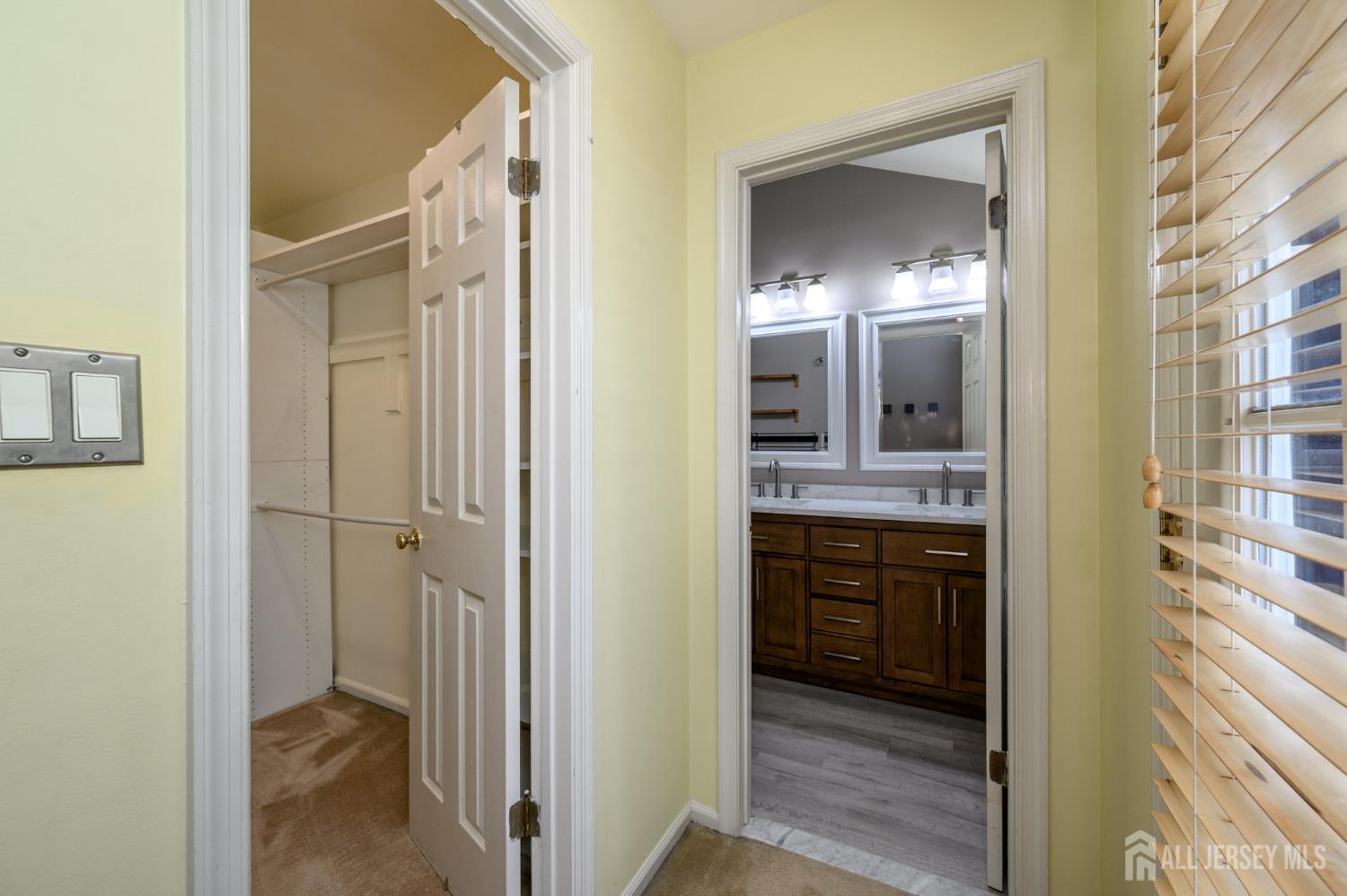 1907 Stech Drive Bridgewater, NJ 08807 - Photo 28 of 55 a en suite bathroom with a sink and a mirror