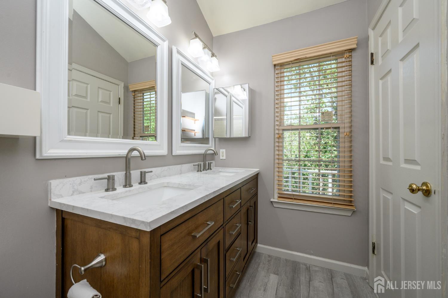 1907 Stech Drive Bridgewater, NJ 08807 - Photo 32 of 55 a bathroom with a sink double vanity and a mirror