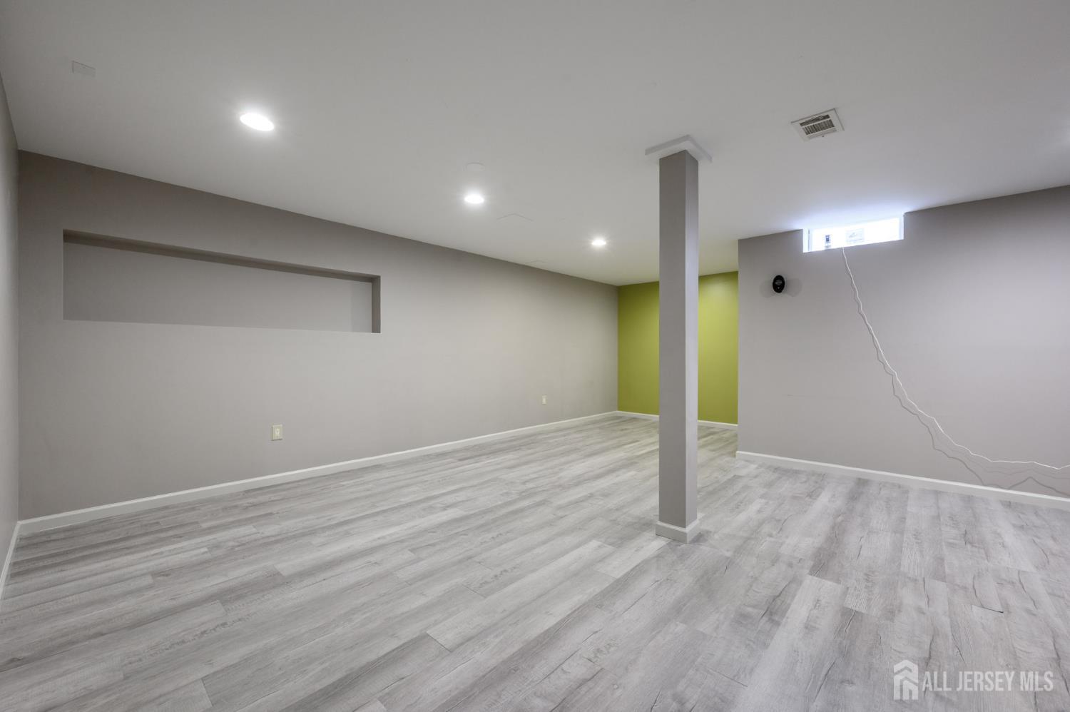 1907 Stech Drive Bridgewater, NJ 08807 - Photo 37 of 55 an empty room with wooden floor and entrance