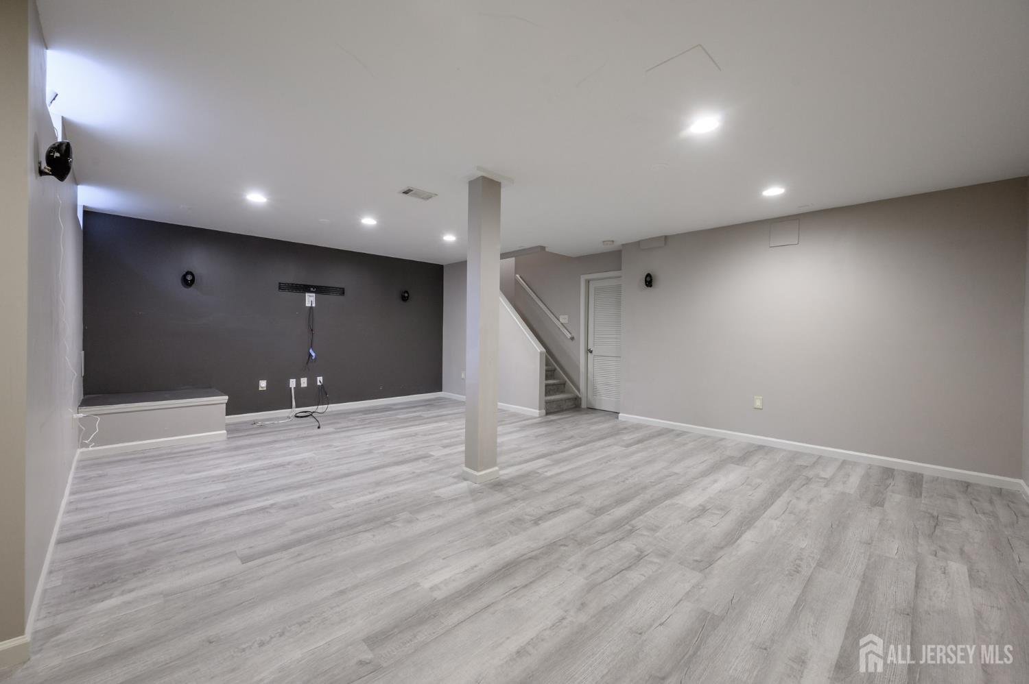 1907 Stech Drive Bridgewater, NJ 08807 - Photo 39 of 55 a view of an empty room with wooden floor