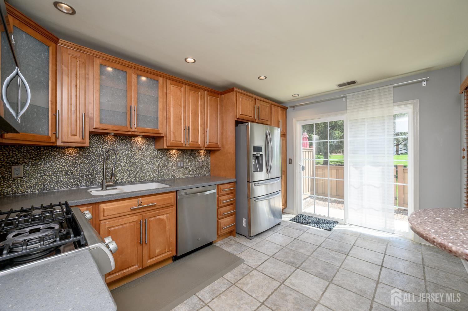 1907 Stech Drive Bridgewater, NJ 08807 - Photo 4 of 55 a kitchen with stainless steel appliances granite countertop a refrigerator stove top oven and sink
