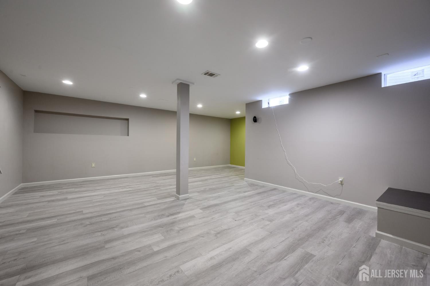 1907 Stech Drive Bridgewater, NJ 08807 - Photo 41 of 55 a view of an empty room with wooden floor