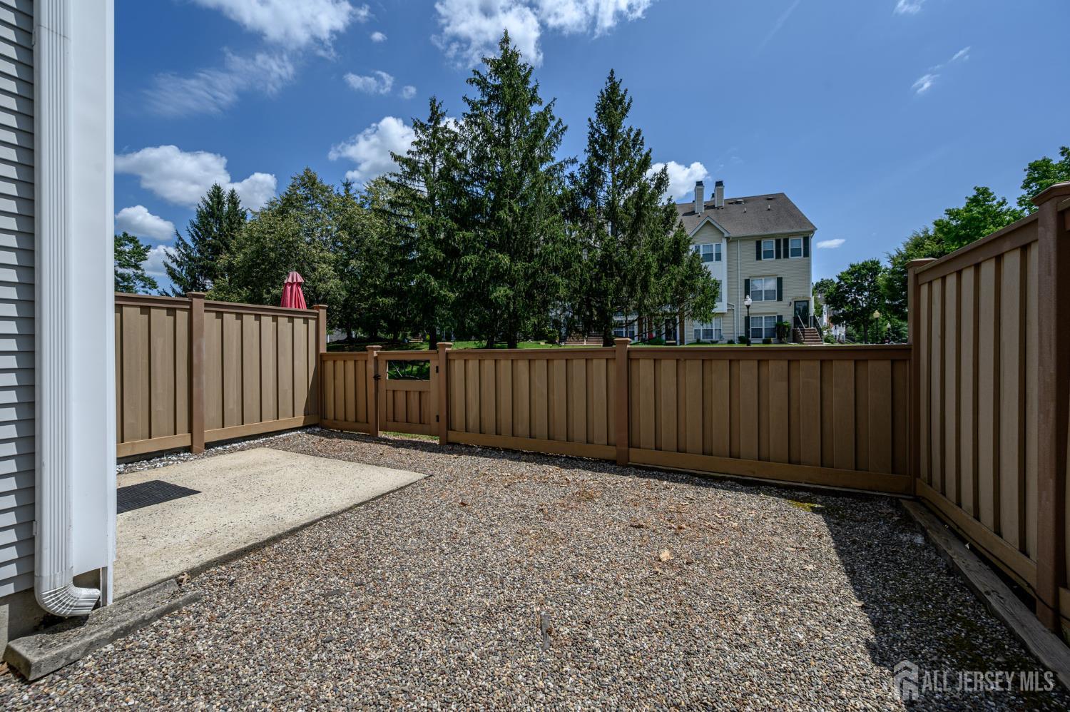 1907 Stech Drive Bridgewater, NJ 08807 - Photo 44 of 55 a view of backyard with wooden fence and trees
