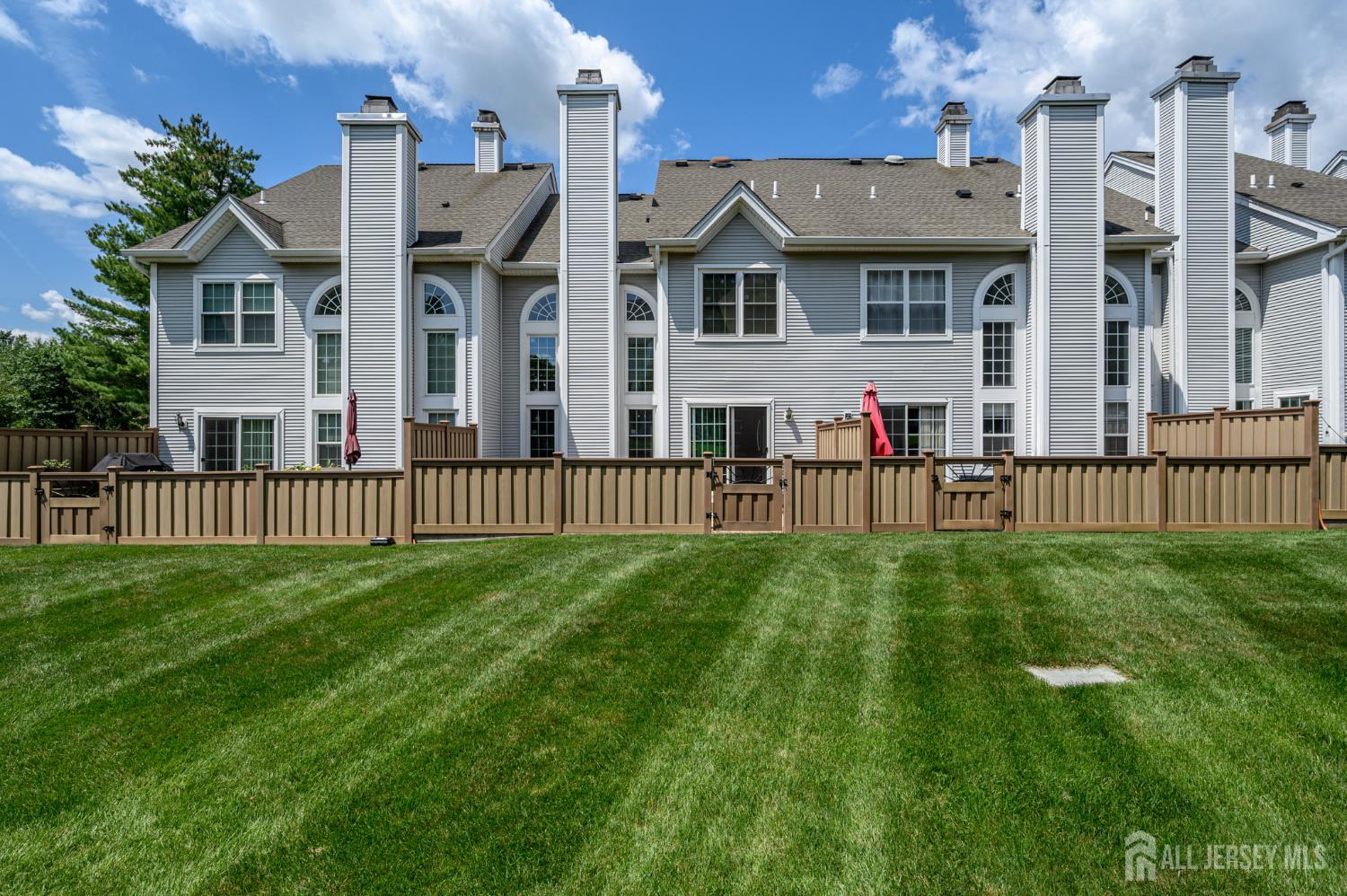 1907 Stech Drive Bridgewater, NJ 08807 - Photo 49 of 55 a view of a white house in front of a big yard