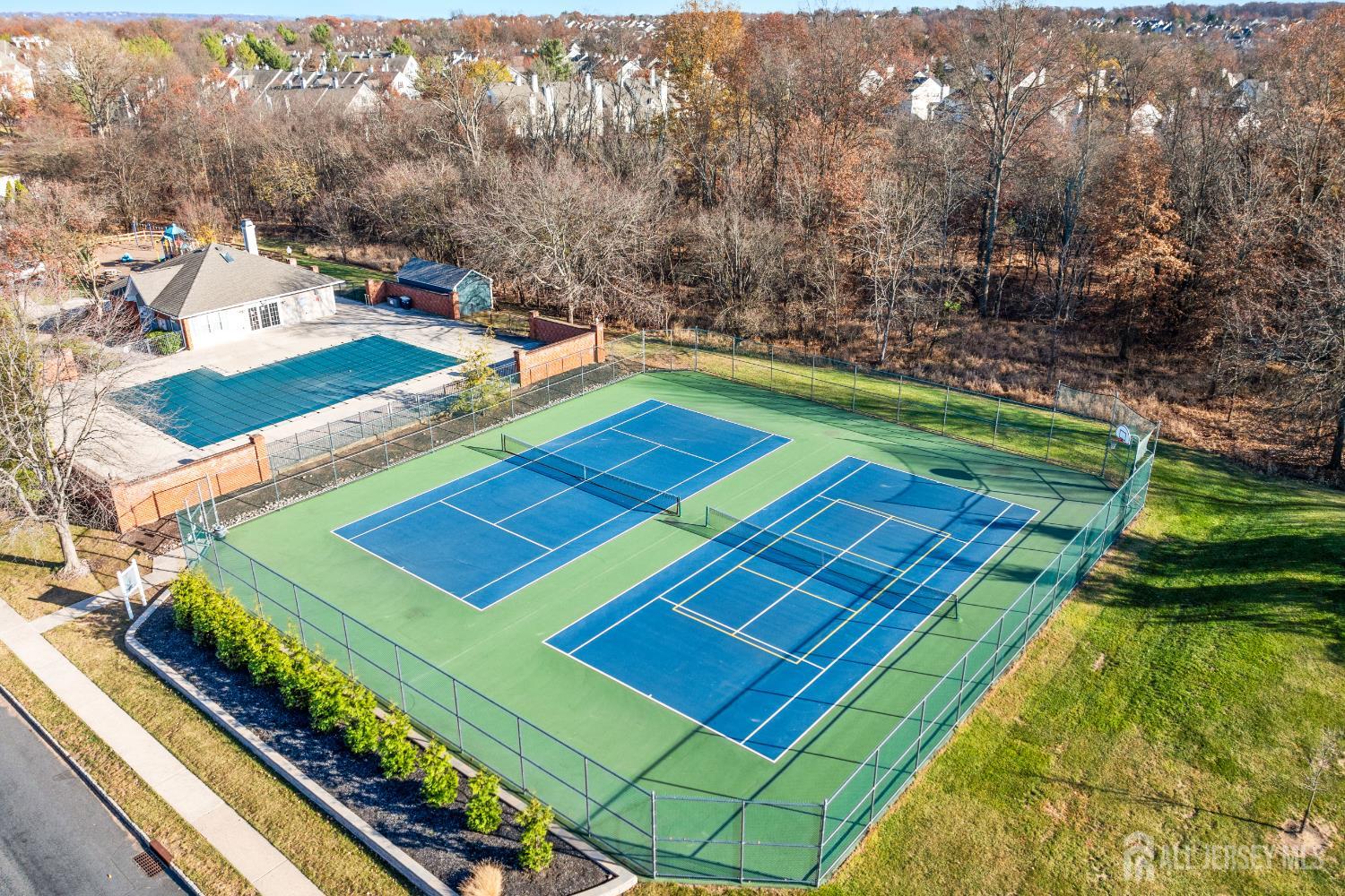 1907 Stech Drive Bridgewater, NJ 08807 - Photo 51 of 55 a view of a tennis ground with large trees
