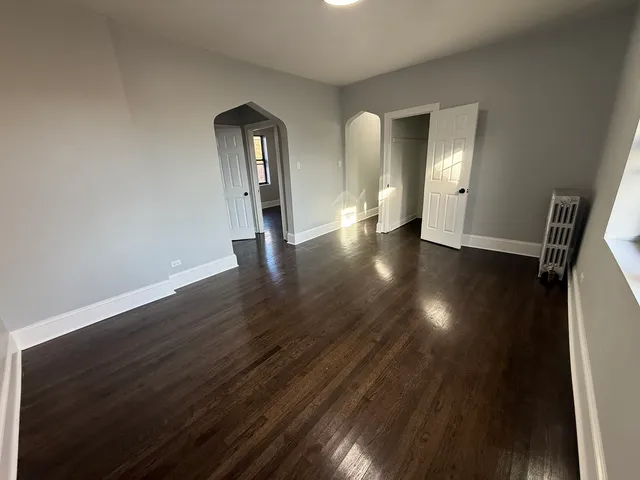 a view of gallery with wooden floor