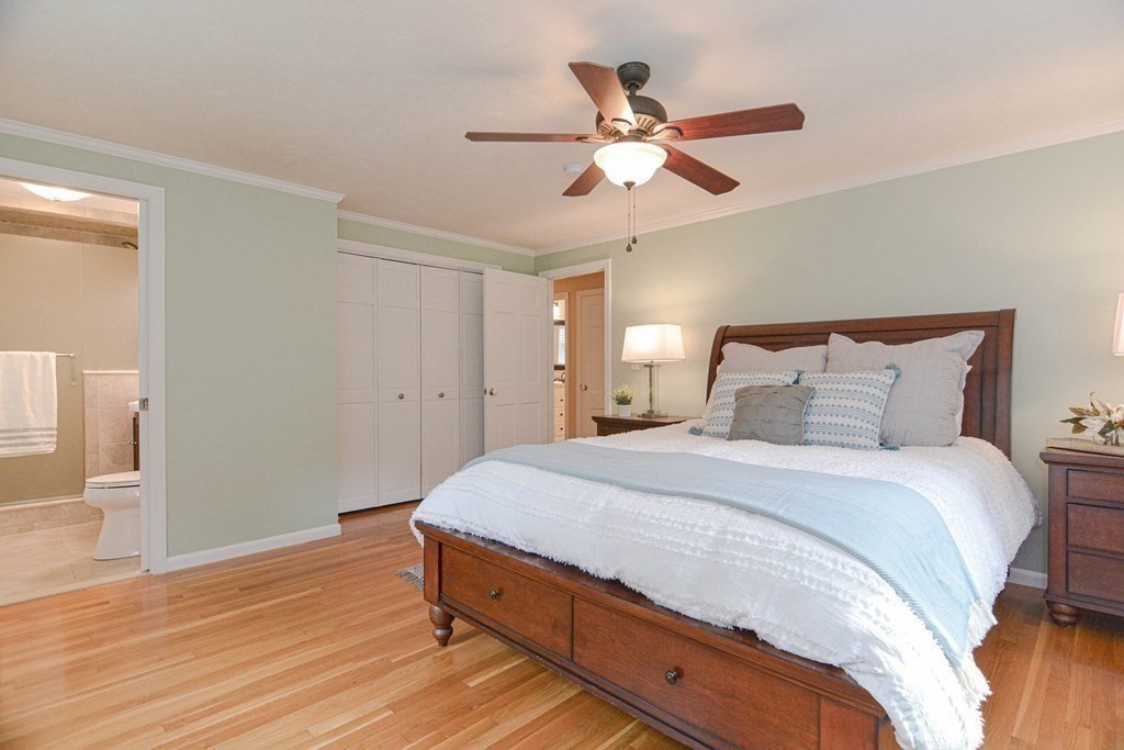 520 Burroughs Road Boxborough, MA 01719 - Photo 13 of 34 a bedroom with a bed and a chandelier
