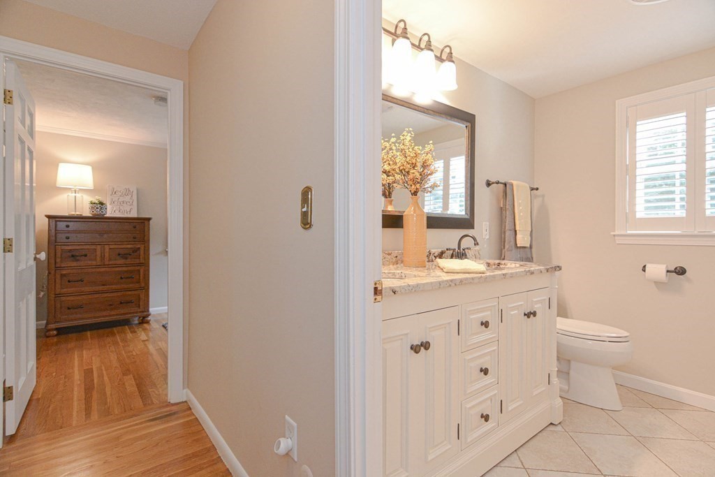 520 Burroughs Road Boxborough, MA 01719 - Photo 15 of 34 a bathroom with a granite countertop sink toilet and shower