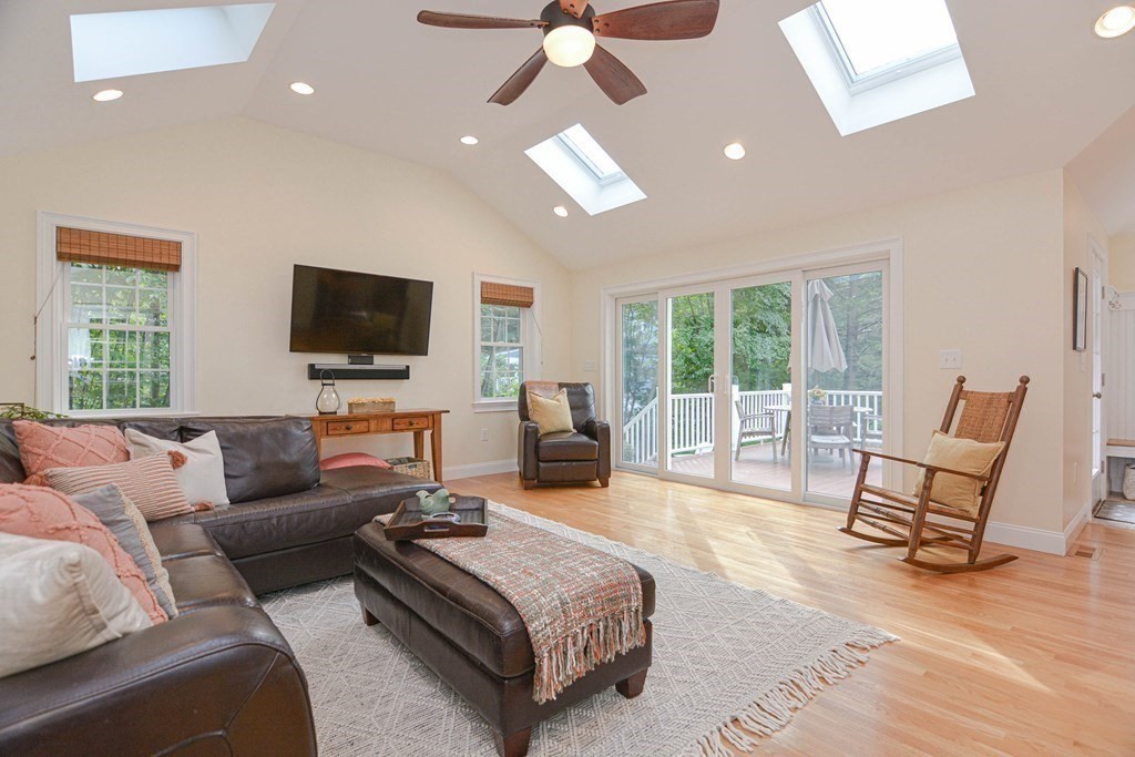520 Burroughs Road Boxborough, MA 01719 - Photo 2 of 34 a living room with furniture a flat screen tv and a large window