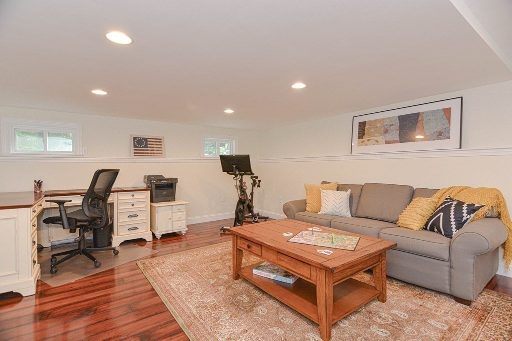 520 Burroughs Road Boxborough, MA 01719 - Photo 21 of 34 a living room with furniture and a wooden floor
