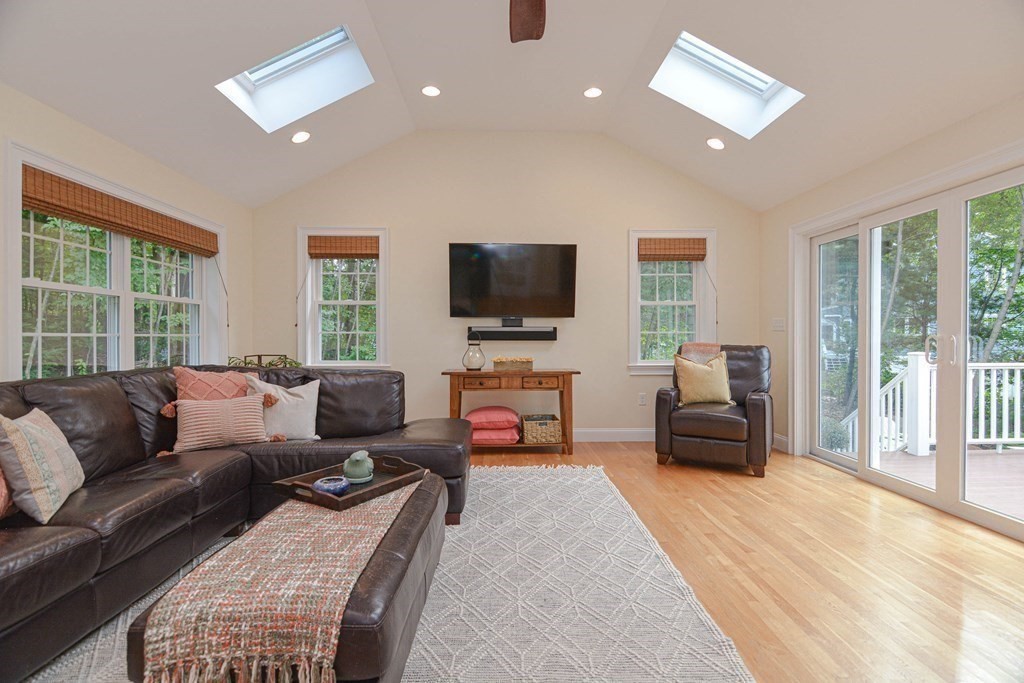 520 Burroughs Road Boxborough, MA 01719 - Photo 3 of 34 a living room with furniture and a flat screen tv