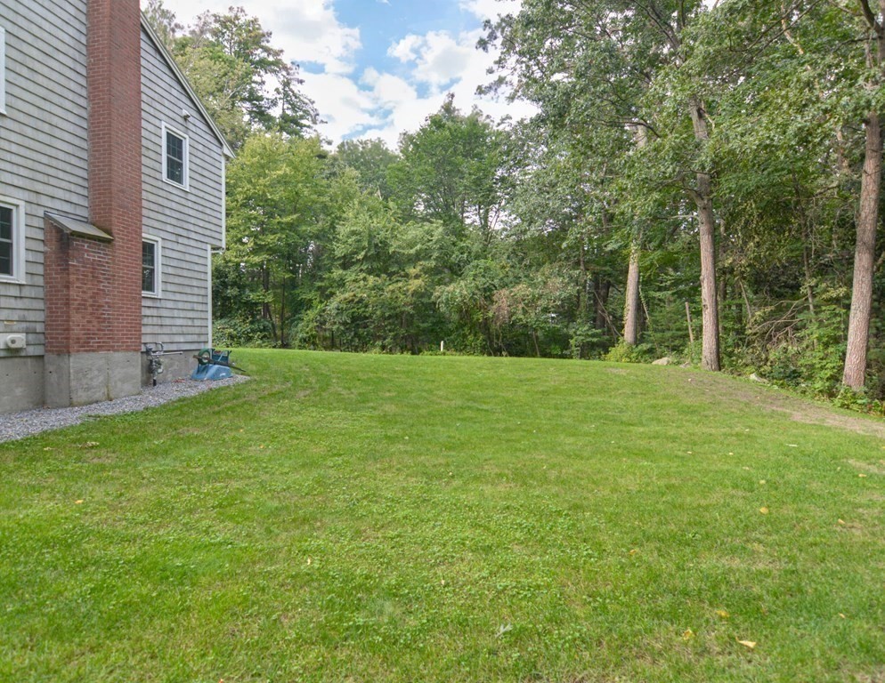 520 Burroughs Road Boxborough, MA 01719 - Photo 31 of 34 a view of a backyard with a garden