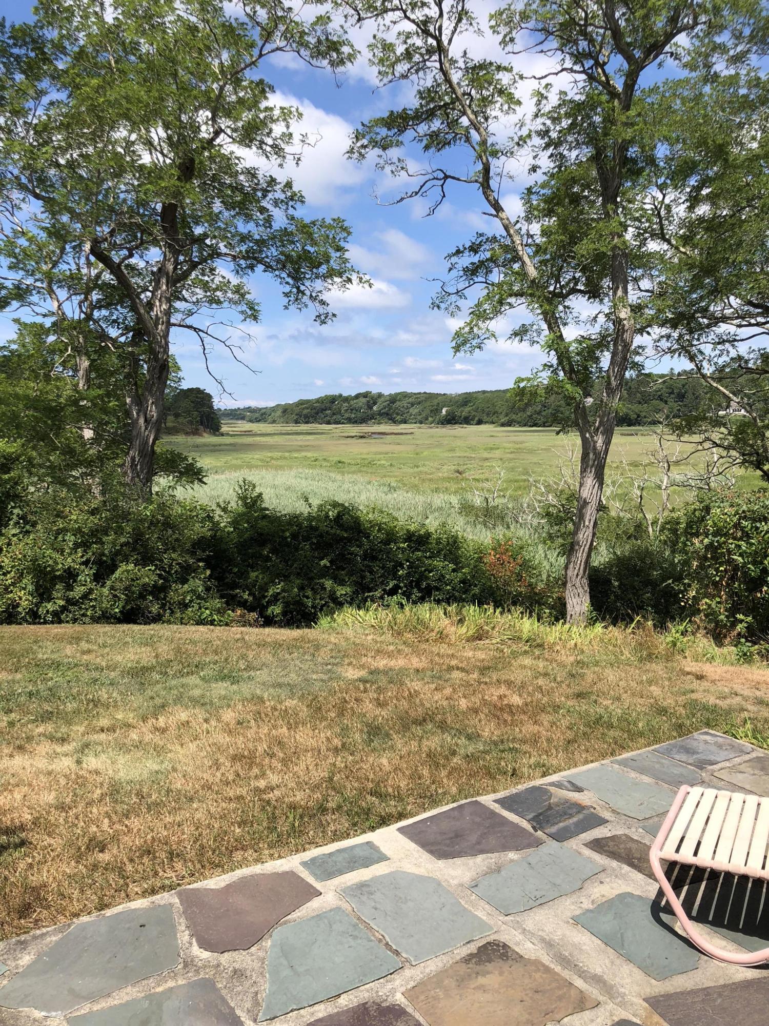 2 Noah's Way Truro, MA 02666 - Photo 14 of 21 a view of a yard with an outdoor space and seating area