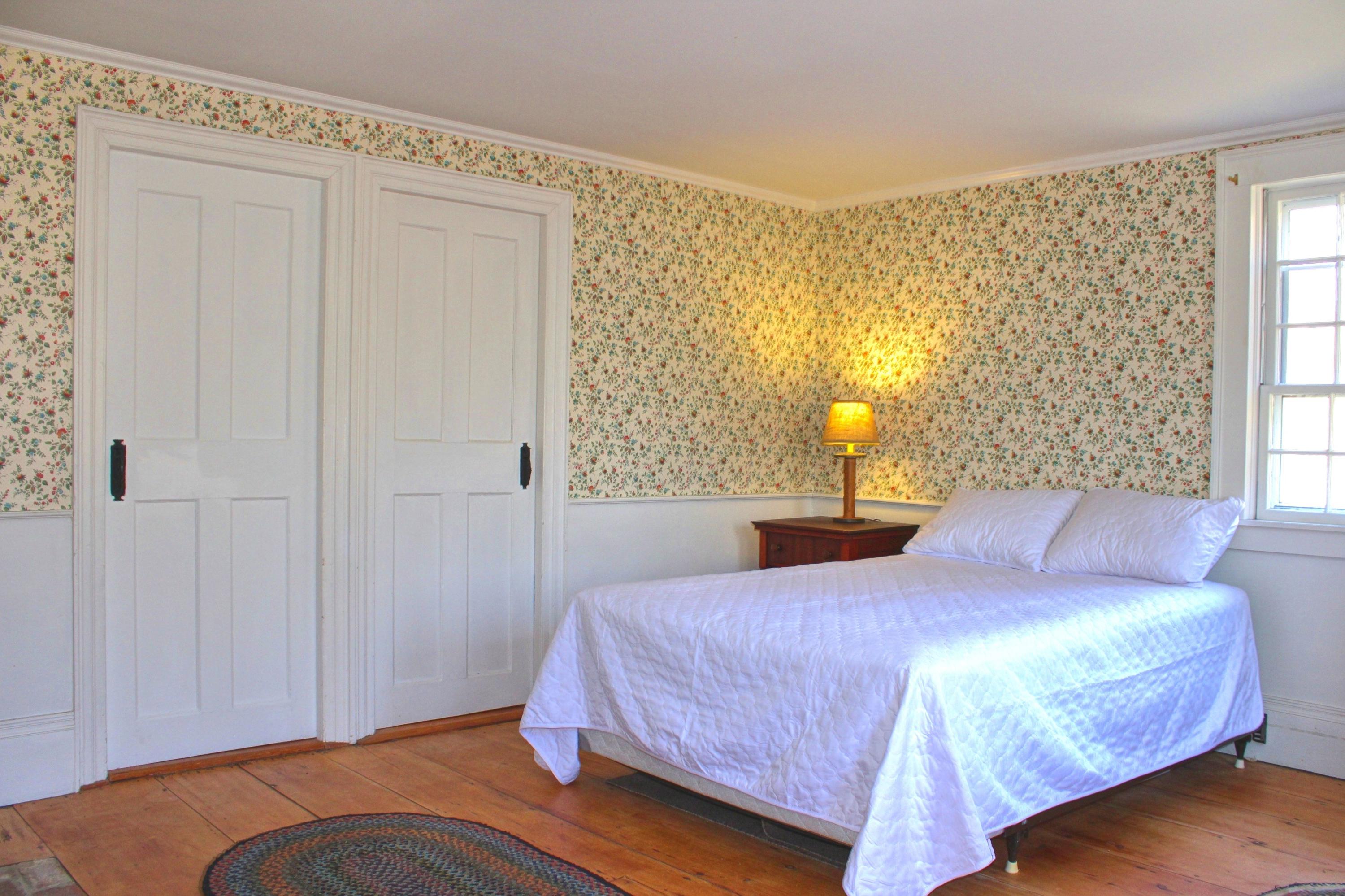 2 Noah's Way Truro, MA 02666 - Photo 17 of 21 a bedroom with a bed and wooden floor