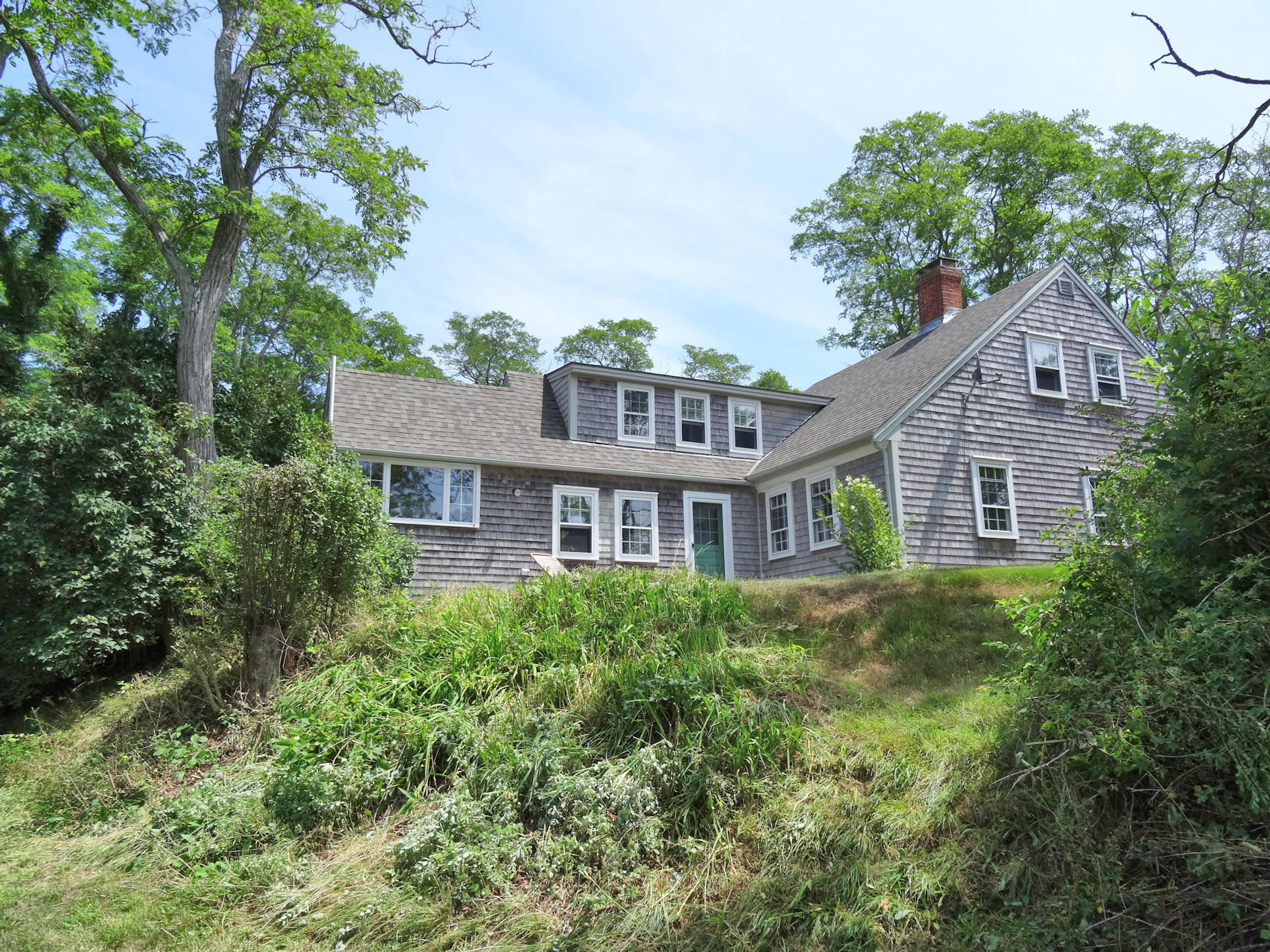 2 Noah's Way Truro, MA 02666 - Photo 20 of 21 a front view of a house with a garden