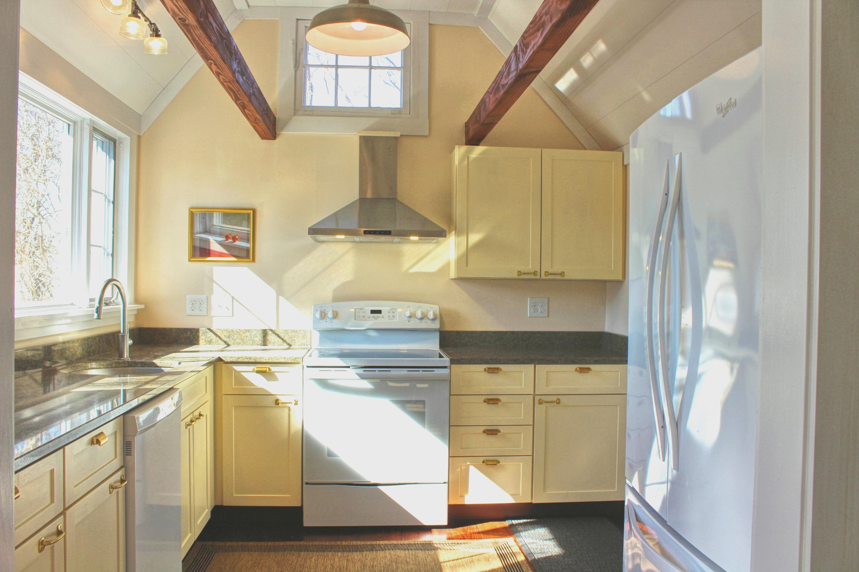 2 Noah's Way Truro, MA 02666 - Photo 8 of 21 a kitchen with kitchen island a stove a sink and a refrigerator