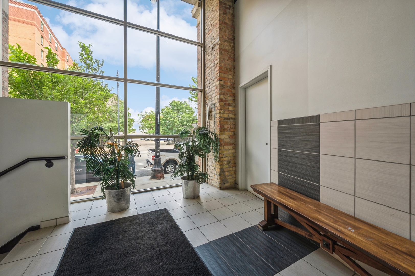 1528 South Wabash Avenue, Unit 405 Chicago, IL 60605 - Photo 10 of 10 a view of a balcony with chairs and a potted plant