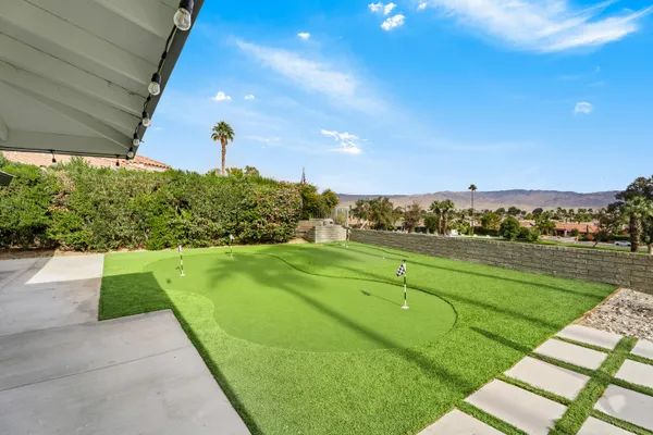 a view of a golf course with a lake view