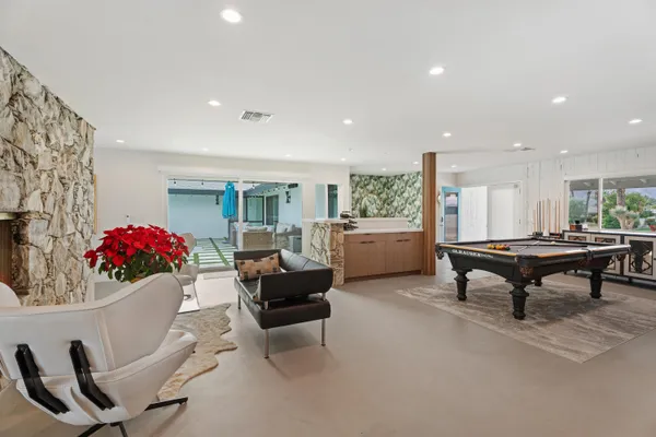 a room with furniture and white walls