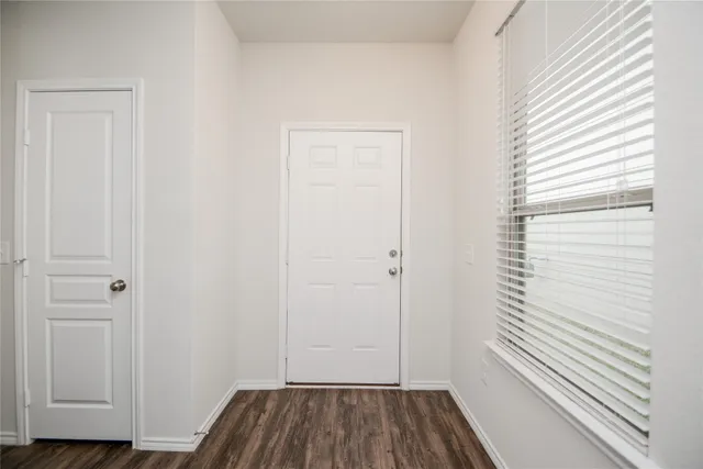 a view of a room that has a window