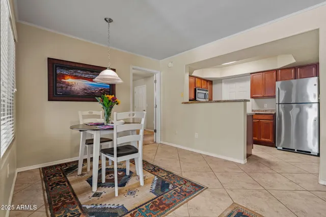 a kitchen with granite countertop a stove sink and microwave