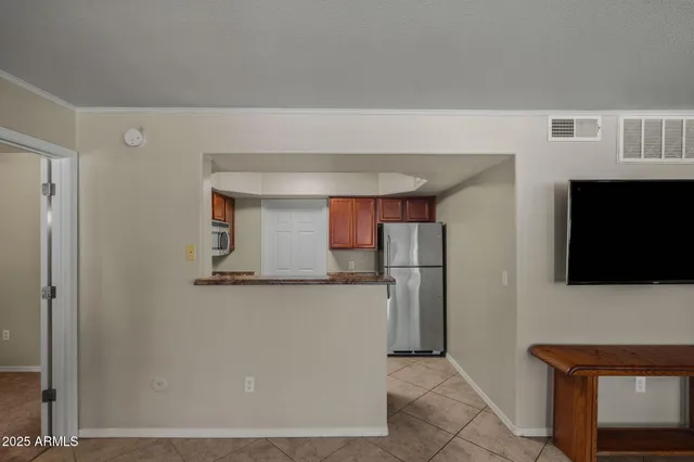 a kitchen with stainless steel appliances granite countertop a stove and a sink