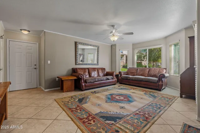 a living room with furniture rug and window