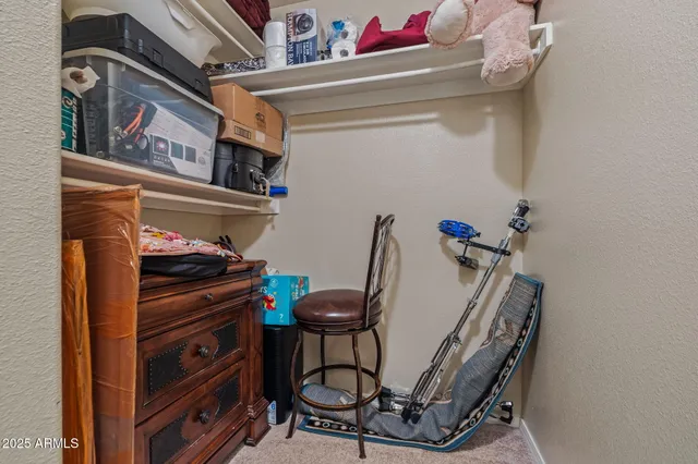 a bathroom with a granite countertop toilet a sink and shower