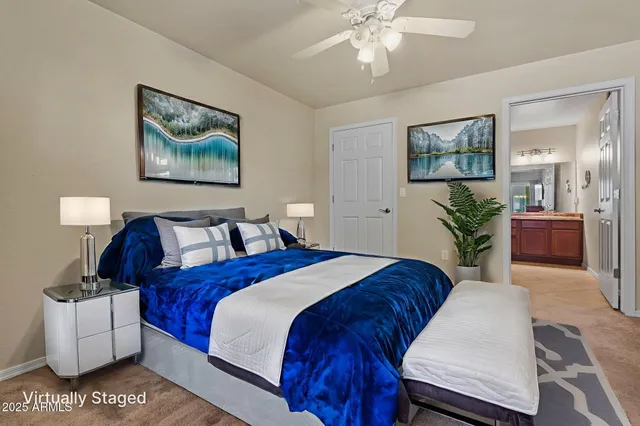 a front view of a house with a big yard and potted plants