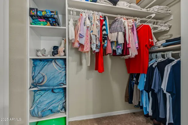 an aerial view of a house with garden space and street view