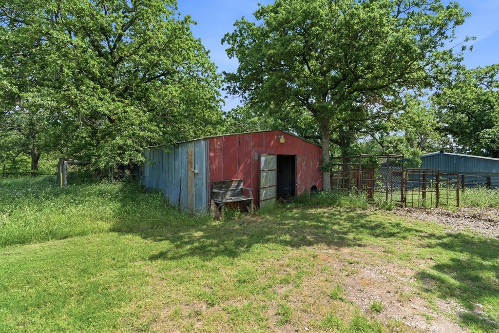 3523 East Highway 199 Springtown, TX 76082 - Photo 27 of 40 Red barn surrounded by mature trees