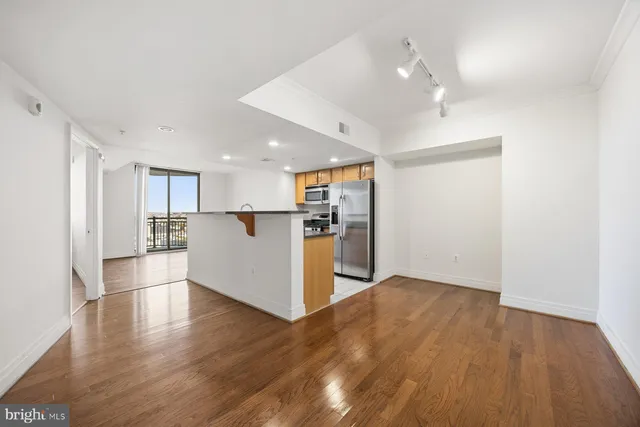 a view of kitchen with wooden floor and window