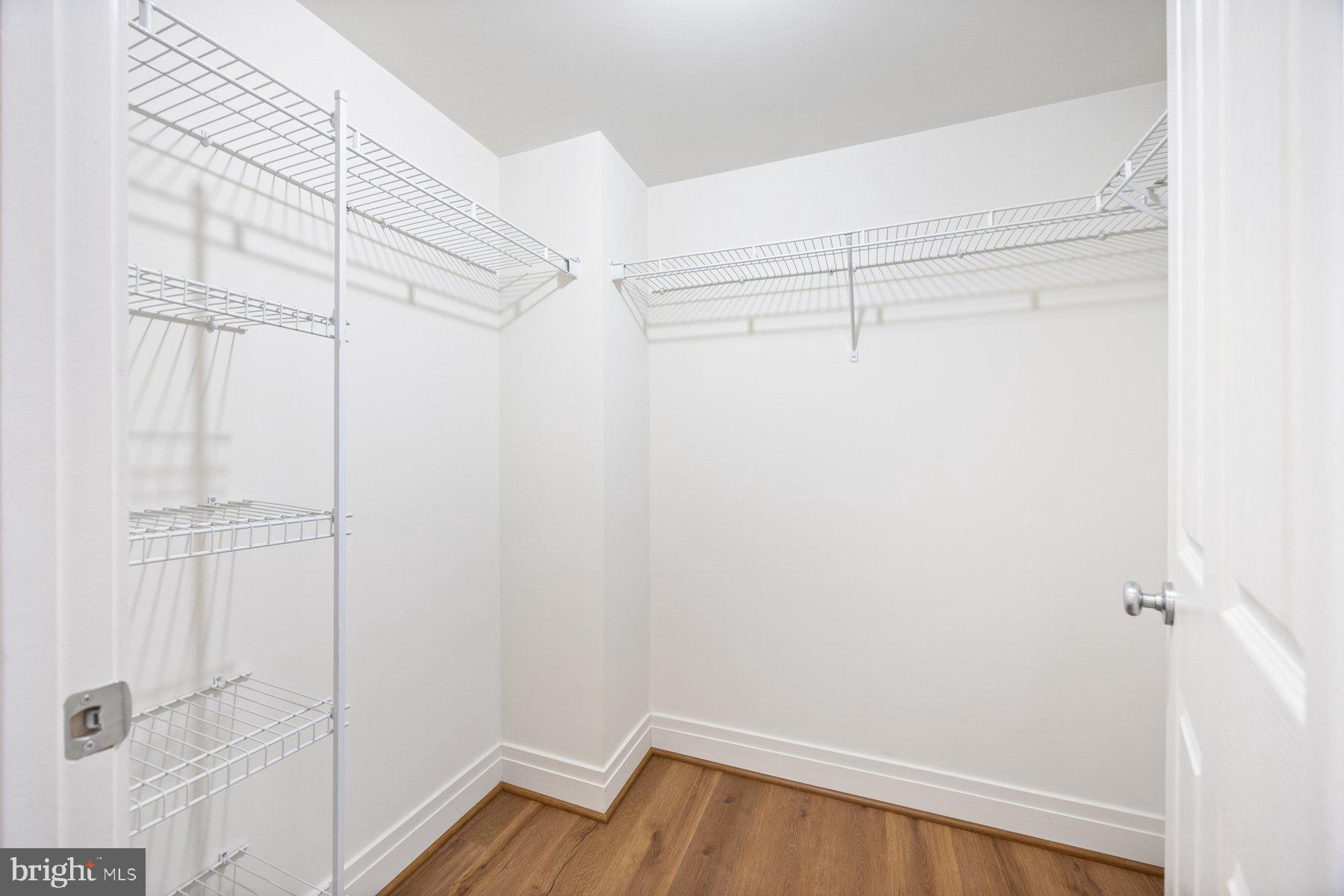 414 Water Street, Unit 2309 Baltimore, MD 21202 - Photo 23 of 36 a view of a room with racks on the wall