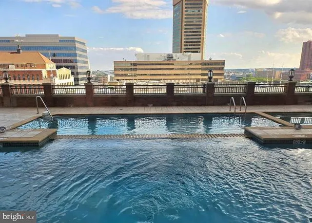 a view of a swimming pool with a lounge chair