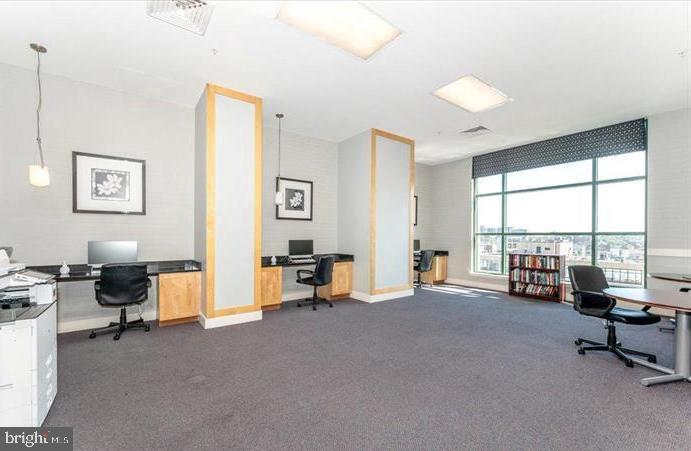 414 Water Street, Unit 2309 Baltimore, MD 21202 - Photo 33 of 36 a view of a livingroom with workspace and a window