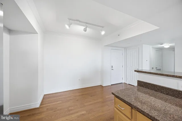 a view of a kitchen cabinets and wooden floor