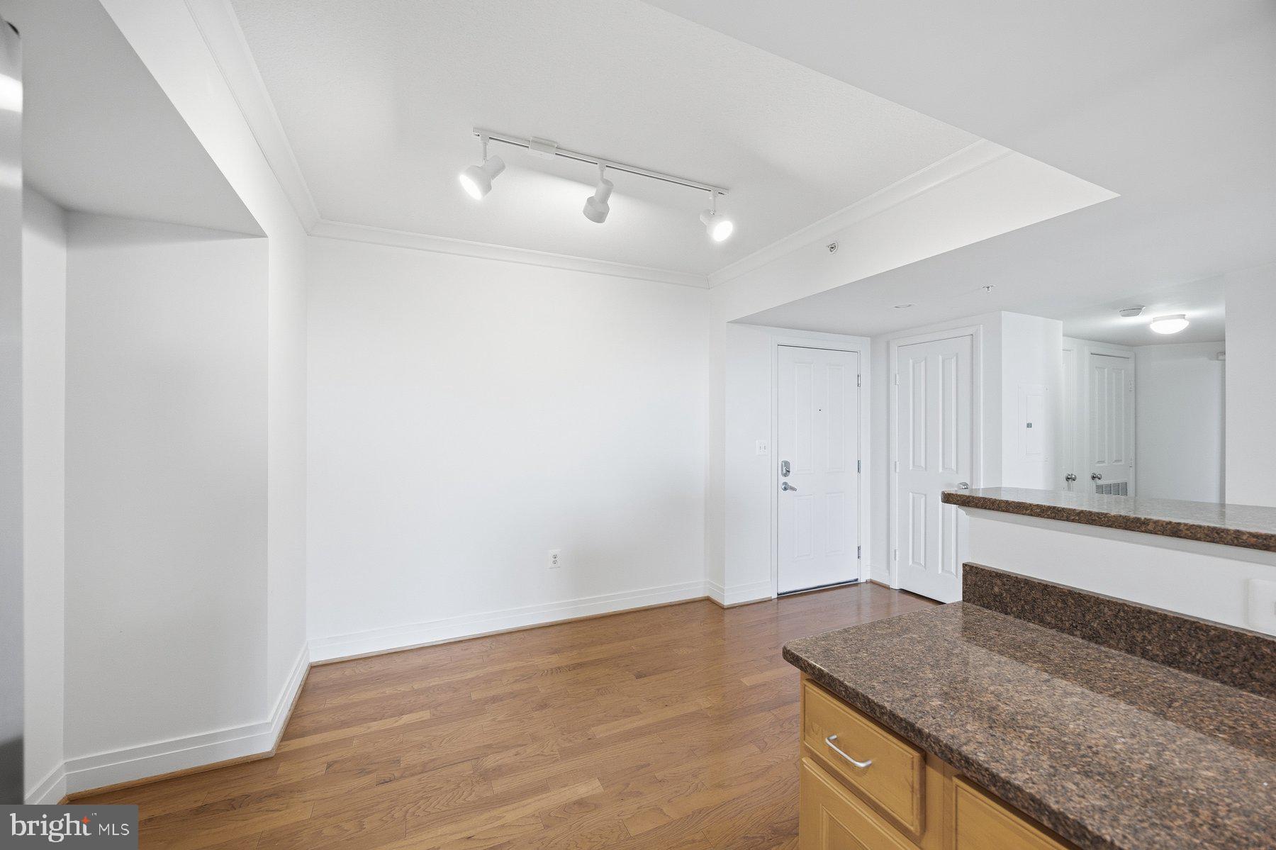 414 Water Street, Unit 2309 Baltimore, MD 21202 - Photo 4 of 36 a view of a kitchen cabinets and wooden floor