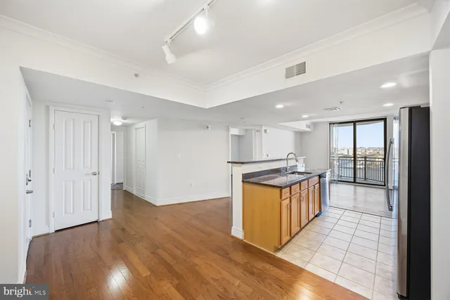 a kitchen with stainless steel appliances granite countertop a stove and a refrigerator