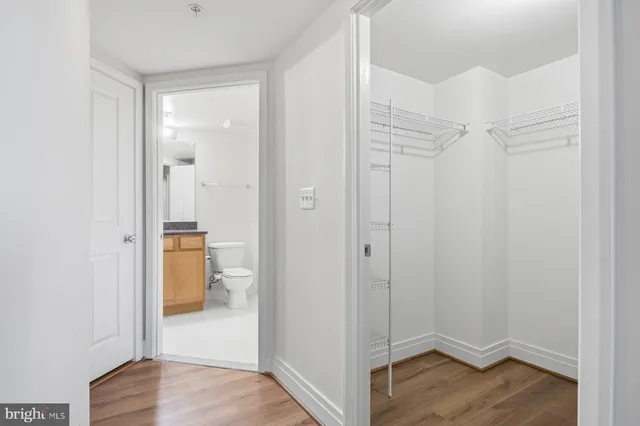 a view of hallway with wooden floor