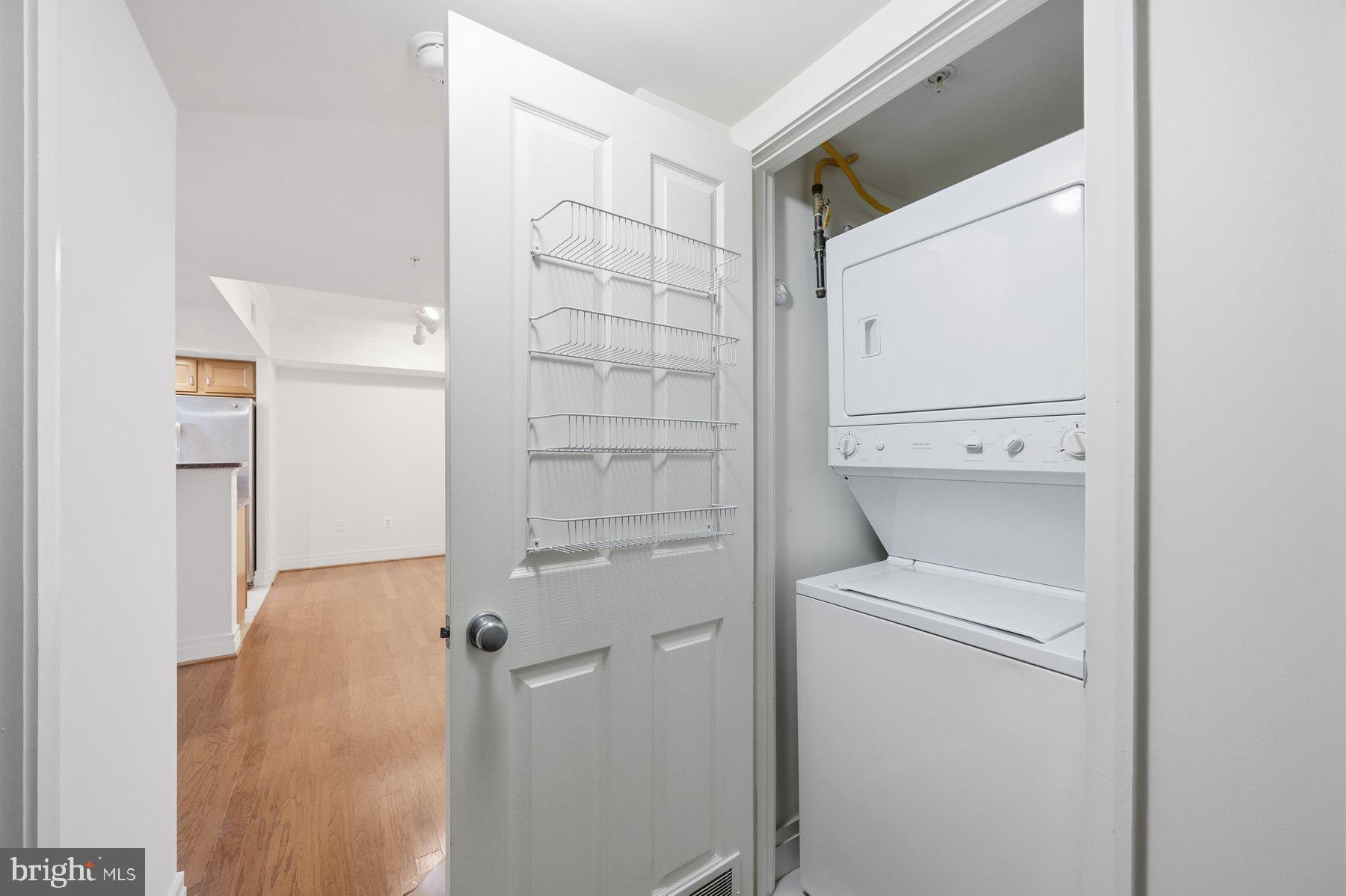 414 Water Street, Unit 2309 Baltimore, MD 21202 - Photo 7 of 36 a bathroom with a shower and toilet