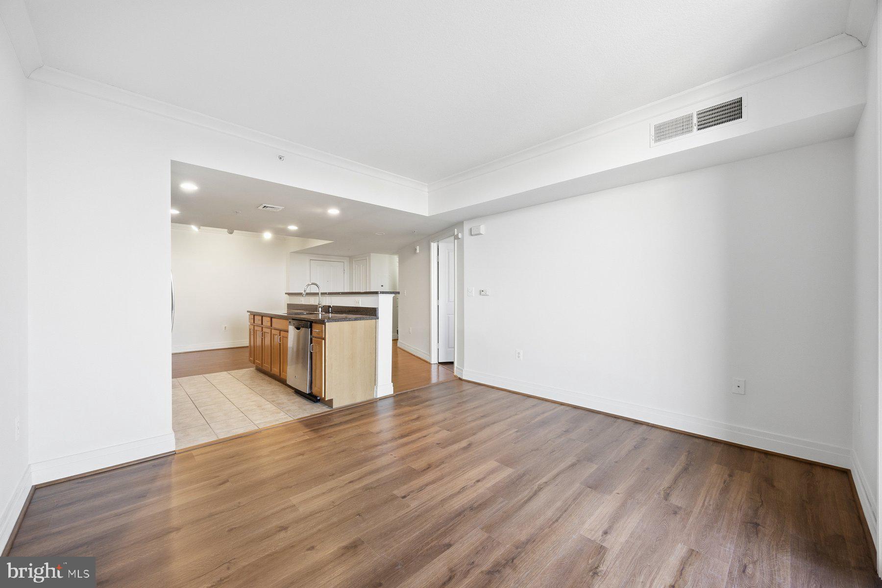 414 Water Street, Unit 2309 Baltimore, MD 21202 - Photo 10 of 36 a view of kitchen with wooden floor
