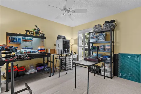 a view of a workspace with furniture