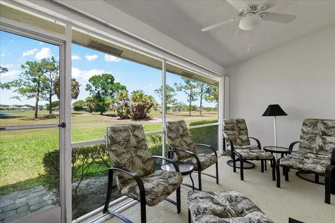 a view of a livingroom with furniture and a window