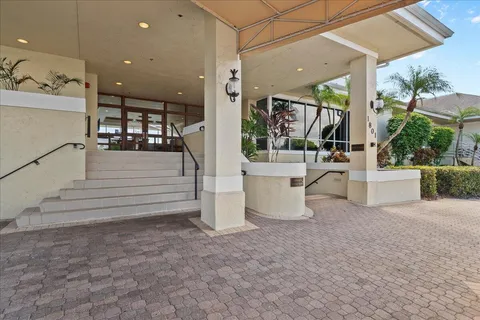 a swimming pool with outdoor seating and yard