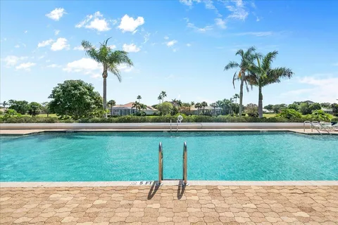 a view of swimming pool from a balcony
