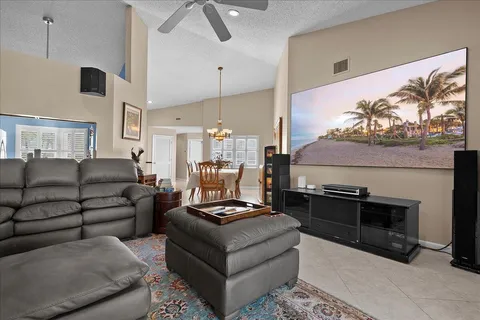 a living room with furniture a rug and a fireplace