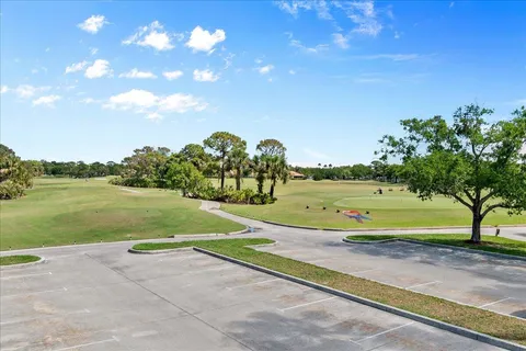 a view of a lake with a house swimming pool and outdoor space