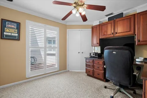 a view of workspace with furniture and a window