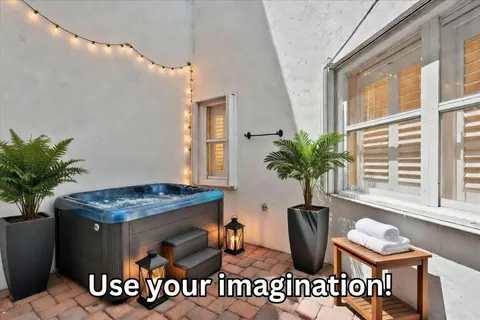 a table with a potted plant and a window